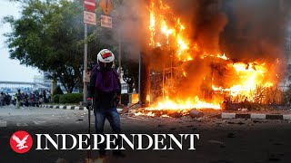 Indonesian protests over controversial labour law turn violent