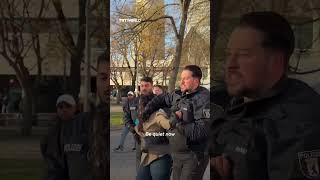German police officer smothers mouth of pro-Palestinian protester