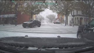 Tracking road conditions as snow begins to cover roads in metro Atlanta