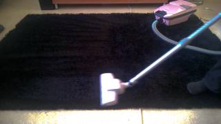 Vacuuming high pile rug with old Volta