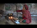 village mother is cooking delicious food items nepali village