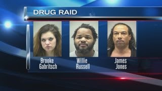 Raid on apartment nets drugs, weapons, and arrests