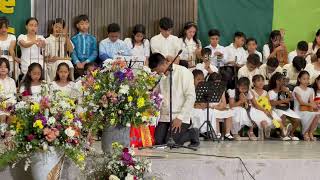 NLAC Centennial Celebration 110-Elementary student praying at Sabbath service