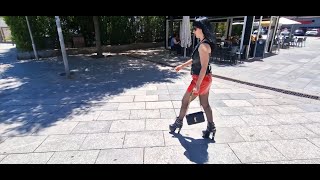 VICTORIA DEVIL- Walking through the square, red and black outfit, stockings and black ankle boots.