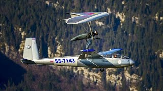 Hang Glider Touches Down on Sail Plane