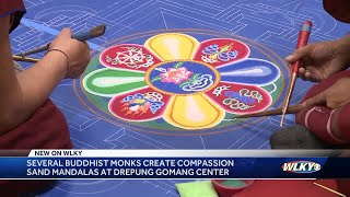 Several Buddhist monks create compassion sand mandalas at Drepung Gomang Center