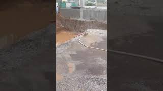 dewatering of swimming pool foundation in progress using petrol engine pump