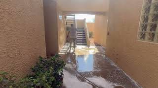 Hot water pressure washing breezeway at an apartment complex  in Las Vegas