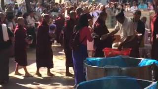 Amarapura monks receiving alms