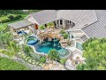 Tropical Backyard Paradise in Fort Myers with Insane 300-square-foot natural rock grotto waterfall!