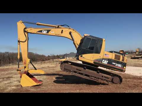 How much does a 318 CAT excavator weight?