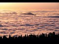 timelapse captures sunlit clouds moving across new mexico mountains