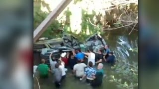 Bystanders flip car in dramatic rescue