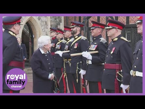 The Queen jokes with a Canadian officer about her medals