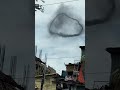 mystery black smoke ring floats in sky shorts