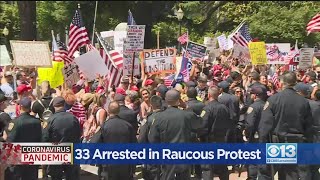 33 Arrested In Raucous Protest