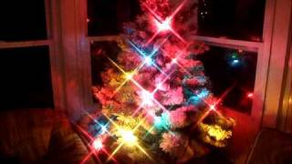 Flocked Christmas tree with c7 flashing lights