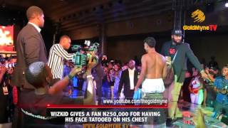 WIZKID GIVES A FAN N250,000 FOR HAVING HIS FACE TATOOED ON HIS CHEST