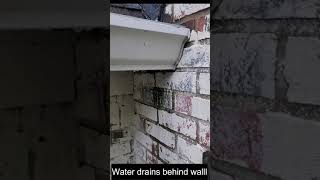 Water Leaking Behind Gutter on to house wall
