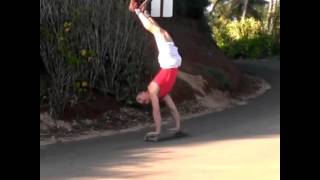 Handstand on longboard.