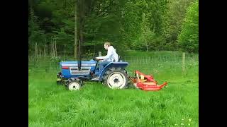 Iseki TU1700 Compact Tractor Mowing With Rotary Cutter