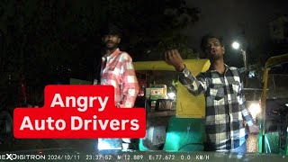 Auto drivers block car and does not let them go