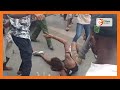 Police rescue a suspected thief from lynching after he was caught by anti-gov't protesters, Mombasa