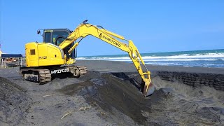 Mini Excavator Sumitomo SH75X-3B Digging  Sand On The Beach For The Shrimp Pond