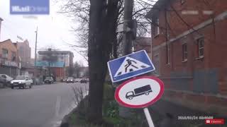 Sign hits man after car hits sign