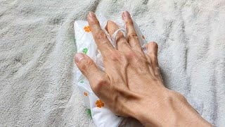 ASMR Sound of a hand touching the top of a tissue box.