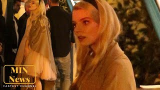 Anya Taylor-Joy looks captivated as she listens to a friend's story after dinner and drinks in LA