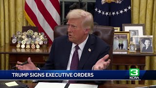 What executive orders did President Donald Trump sign on Day 1?