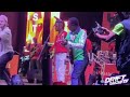 Cody Rank Marshall kneels down to Alick Macheso during Castle Tankard perfomance
