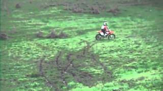 Thrashing a Honda CRF250X in a paddock