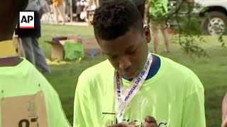 Teen shot in head walks at brain injury event