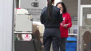 Explosive Trace Detector swab on a female's hands and stomach at airport security