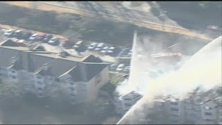 Crews working to extinguish large fire at DeKalb County apartment complex