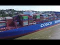 mega container ship cosco shippping star with tug attached leaving hamburg