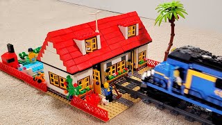 Lego train crash into a town house villa