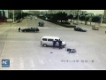 CCTV: red light runner survives car crash