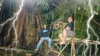 camping in heavy rain under a large banyan tree hundreds of years old