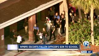 West Palm Beach police escorts fallen officer's son to school