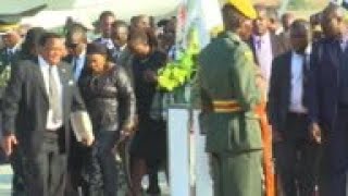 Grace Mugabe in black veil at airport ceremony