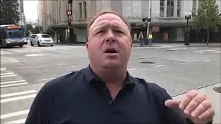 Alex Jones Chases After Guy Who Flips Him Off But The MW2: Juggernaut Music Plays Over It