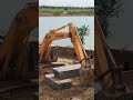 technical excavator pushing rock to truck