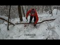 sleeping overnight under a rock during a snowstorm...surviving in sub zero temperatures