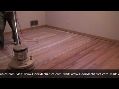 Hardwood floor refinishing: Buffing between coats of finish Hardwood floor refinishing: Buffing between coats of finish