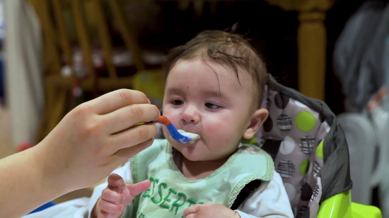 Baby's First Time Eating Solid Food - YouTube