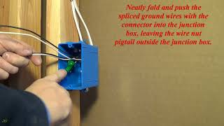 Splicing (connection) of the ground wires in the junction box using a green wire nut.