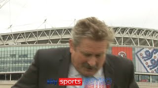 Nick Collins falls off a ladder during a live report